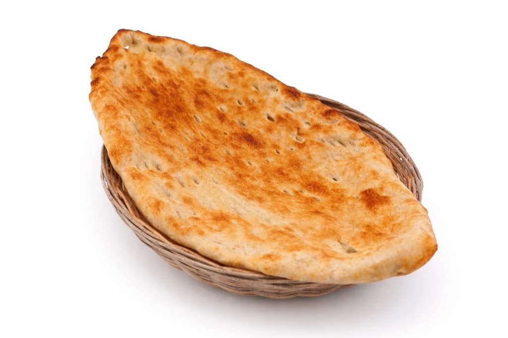 Afghan Bread — Freshly baked tandoor bread — Freshly prepared at Timorian Restaurant